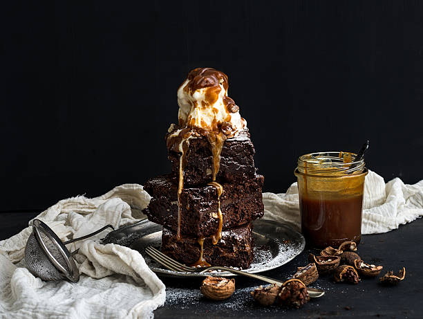 istock Fudgy Brownies tower with salted caramel, walnuts and ice-cream 478502780
