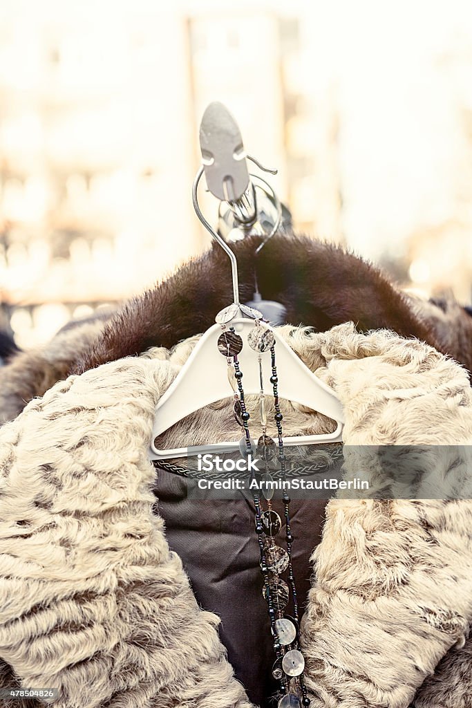 winter jacket with fur collar on a flea market , 2015 Stock Photo