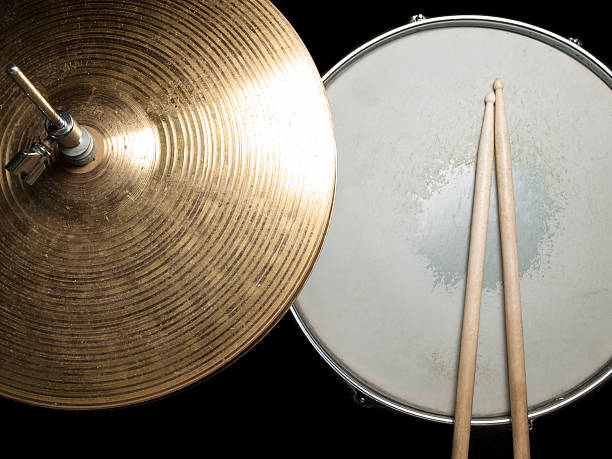 snare drum and hi-hat Worn drumsticks on the snare drum and hi-hat, for music,entertainment themes snare drum stock pictures, royalty-free photos & images