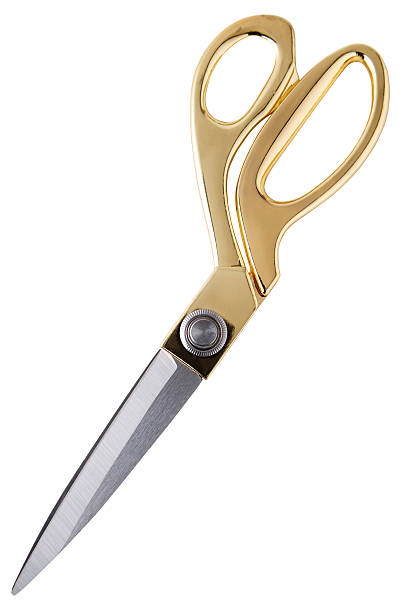 Pair of scissors Pair of tailor scissors with metal golden handle isolated on white background. gold scissors stock pictures, royalty-free photos & images