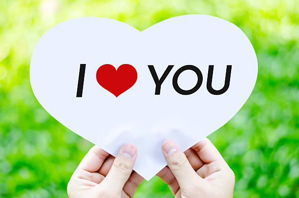 istock Hand holding white heart paper with I love you text 478514012