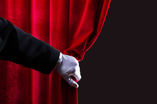 Red curtain Close up of hand in white glove open the curtain. Place for text opera photos stock pictures, royalty-free photos & images