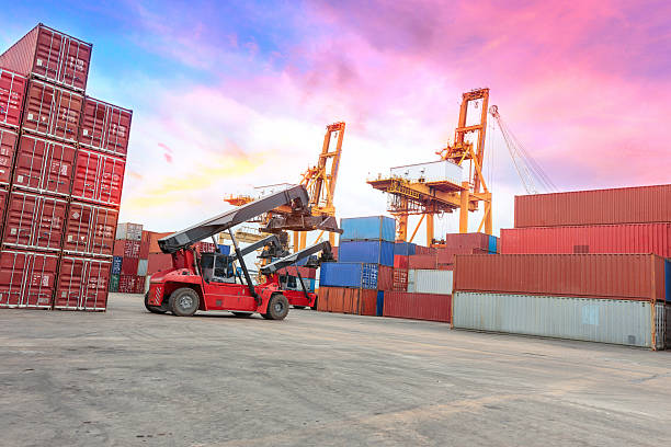 istock forklift at dockyard with big crane at harbor 478515874