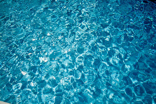 Sparkling clear pool water stock photo