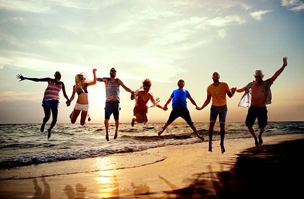 istock Diverse Beach Summer Friends Fun Jump Shot Concept 478520712