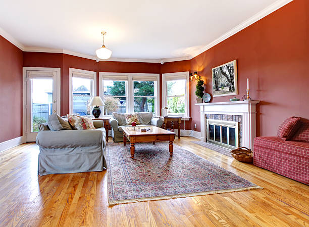 istock Large nice living room with red walls and fireplace. 478529769