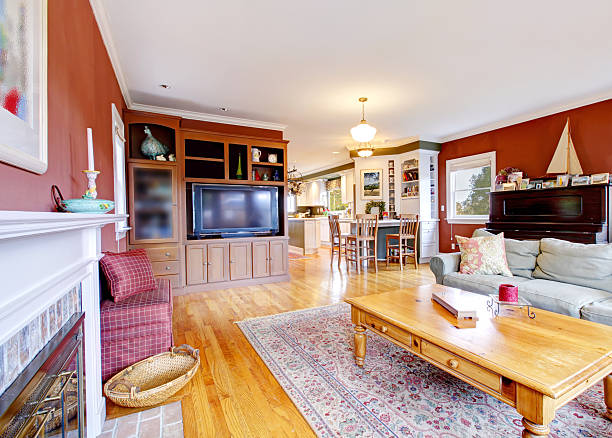 istock Large nice living room with red walls and fireplace. 478529771