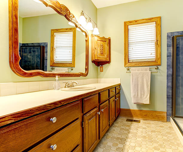 istock Simple bathroom with old cabinets and green walls. 478529993