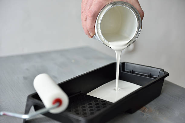 Pouring Paint Into A Painting Tray Stock Photo - Download Image