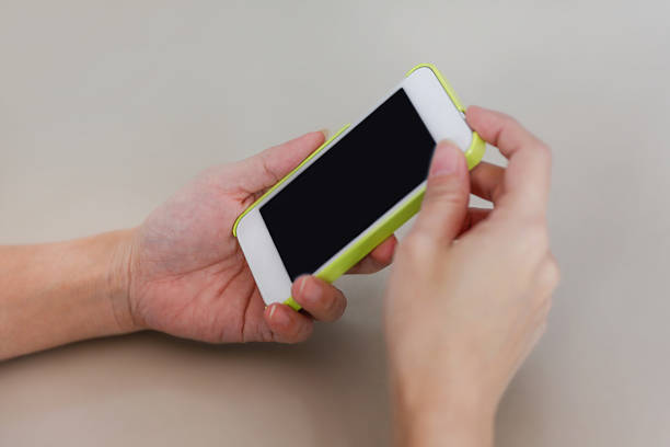 istock Close up woman hands touching smart phone 478540782