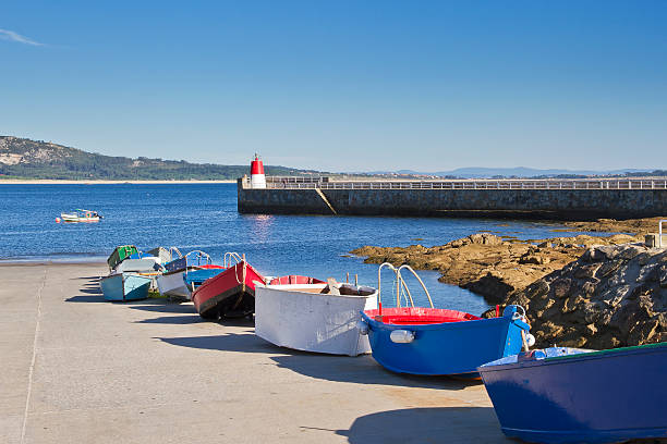 istock Small boats over the quay of Corrubedo 478541004