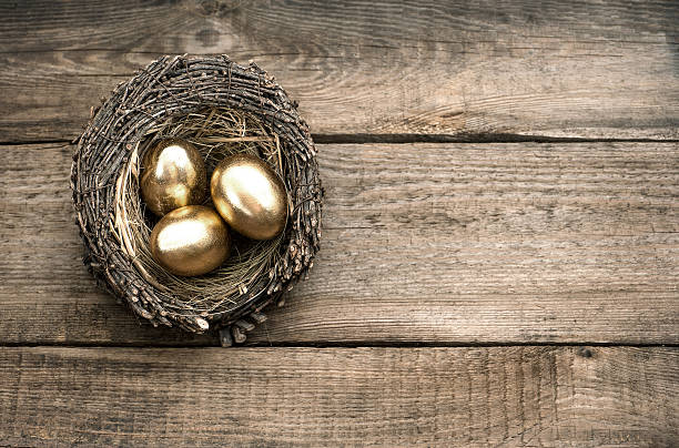 istock golden easter eggs over wooden background 478542041