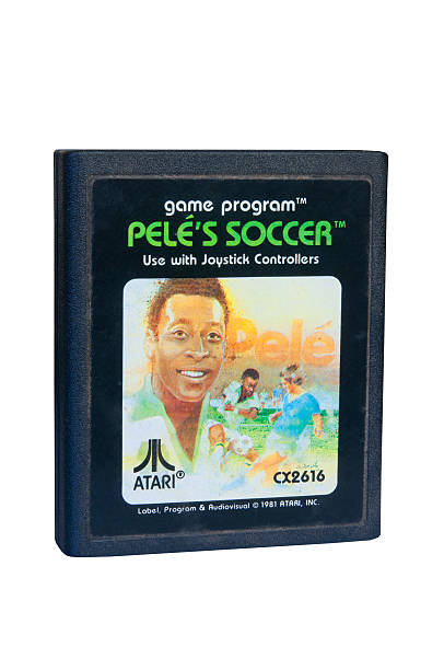 Pele's Soccer Atari 2600 Game Cartiridge Adelaide, Australia - February 06 2015: A Studio shot of an Atari 2600 Pele's Soccer Game Cartridge. A popular video game from the 1980's is popular with collectors and retro gamers worldwide. pele stock pictures, royalty-free photos & images