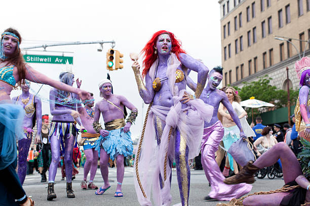 New York, USA - June 20, 2015: Mermaid Parade participants in Coney Island, Brooklyn. The Mermaid Parade has been held since 1983 on the Saturday closest to the summer solstice. It is known for marine costumes and occasional partial nudity. 