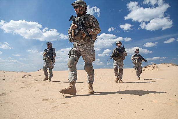 infantrymen in action United States paratroopers airborne infantrymen in action in the desert infantry stock pictures, royalty-free photos & images