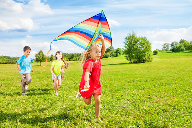 istock Little friends with kite 478547297