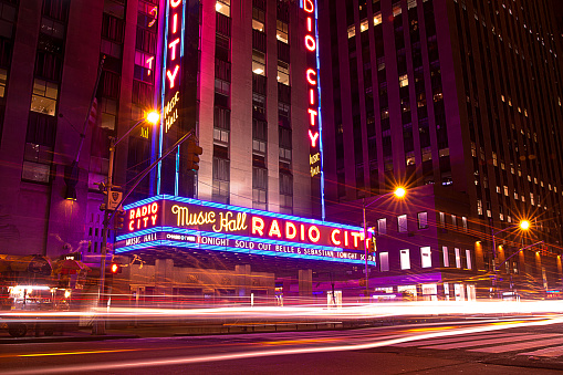 New York, NY, USA - June 10, 2015 - A long exposure image at night on Avenue of Americas facing Radio City Music Hall