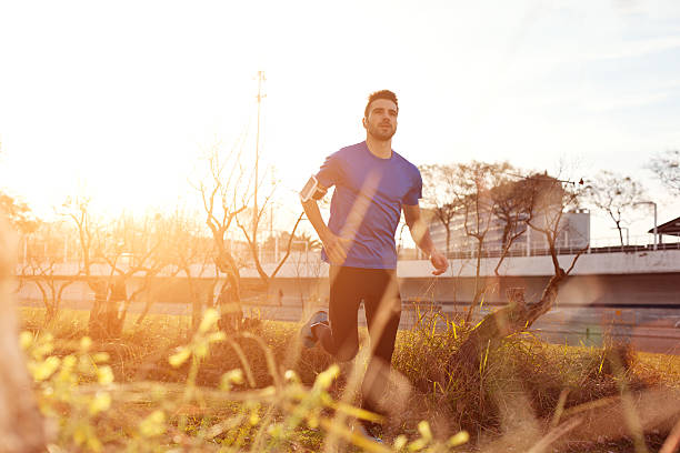 istock Male athlete running in the park 478548342