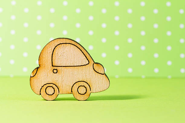 istock Wooden car icon on green background 478548700