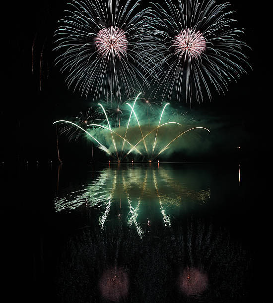 istock Colorful fireworks with reflection on lake. 478549354