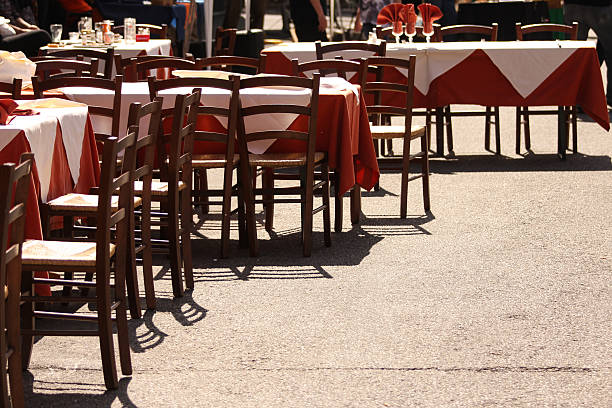 istock Restaurant tables and chairs in a street 478549432