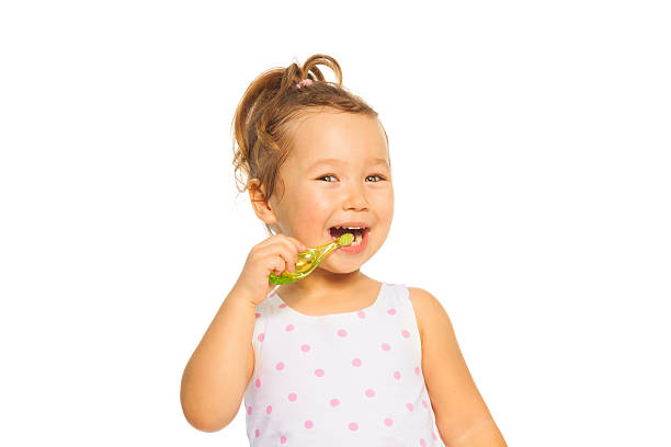 istock Little girl brush her teeth 478549545