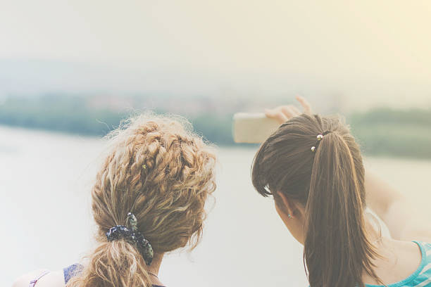 istock Two best girl friends taking selfie 478552156