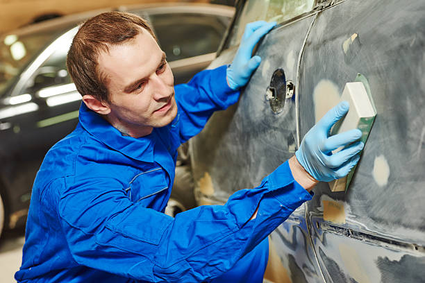 istock auto mechanic polishing car 478555052