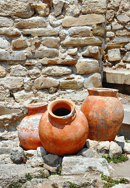 istock ancient amphorae on the backdrop of a stone wall 478556092