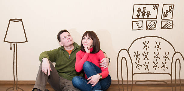 istock Middle aged couple in the new flat. 478556402