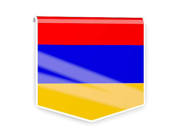 Small paper flag of Armenia pinned. Isolated on white background. Horizontal orientation. Close up photography. Copy space.