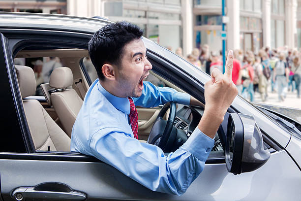 istock Annoyed person driving a car 478559544