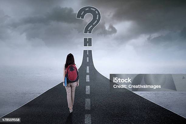 Student On The Highway With Question Mark Stock Photo - Download Image Now - Directional Sign, Occupation, Teenager