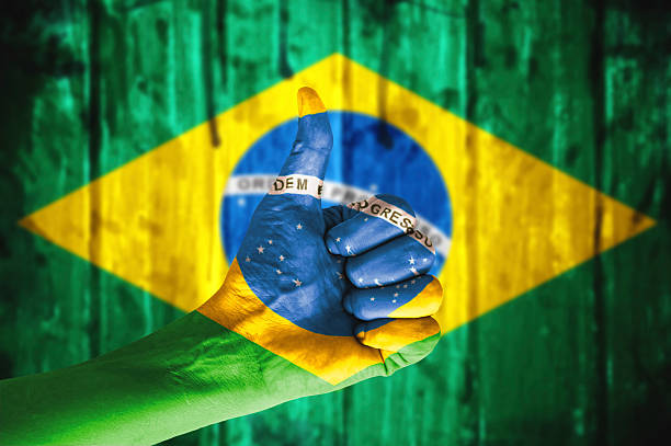 istock Hand covered in flag of Brazil. 478560416