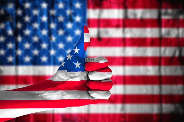 istock Hand covered in flag of USA. 478560420
