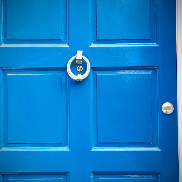 blue handle  in london antique  door  rusty  brass nail and light