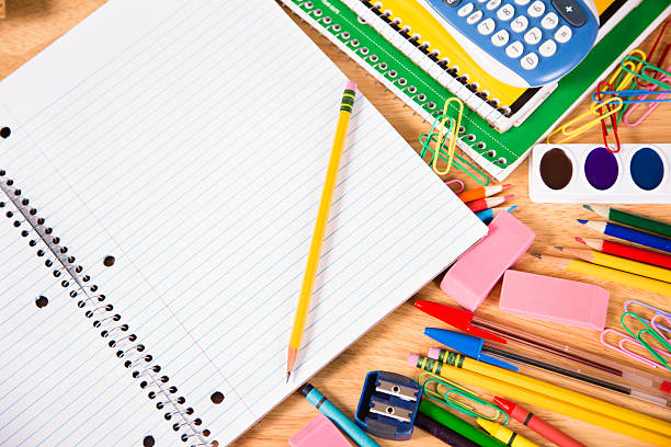 istock Back to school. Pile of school supplies with open notebook. 478562644