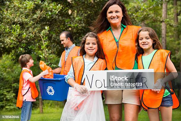 Volunteers Family Cleans Up Their Community Park Recycling Bin Stock Photo - Download Image Now