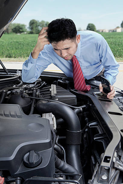 istock Worried man look at his broken car 478565666