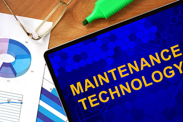 istock Tablet with Maintenance Technology  and charts on a wooden board. 478566280