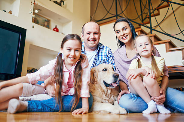 istock Young couple with daughters and dog 478567226
