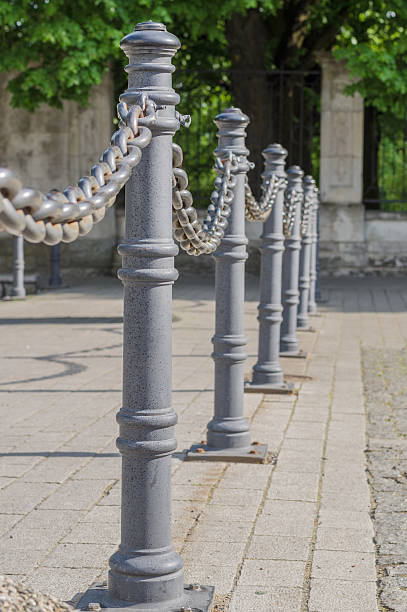 istock Chain fence and poles closeup 478567754