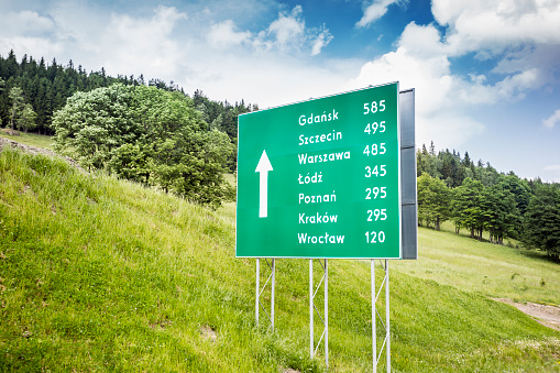 Road sign with distances to major polish cities
