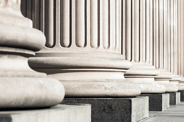 istock Closeup row of classical stone columns, copy space 478572178