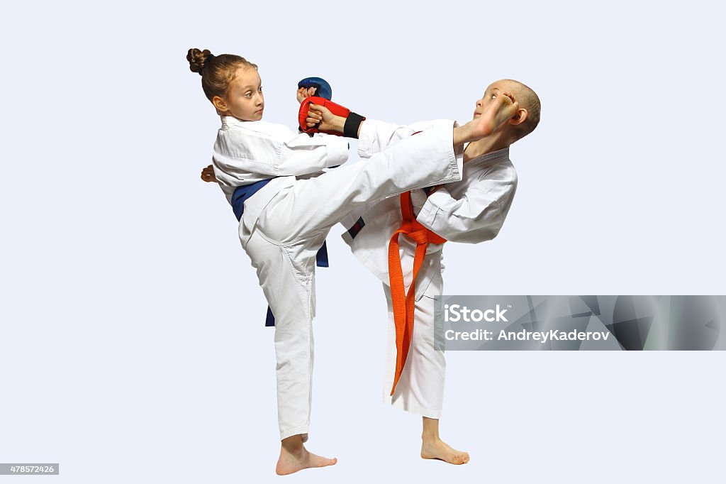 Little athletes perform an exchange of blows mawashi geri 2015 Stock Photo