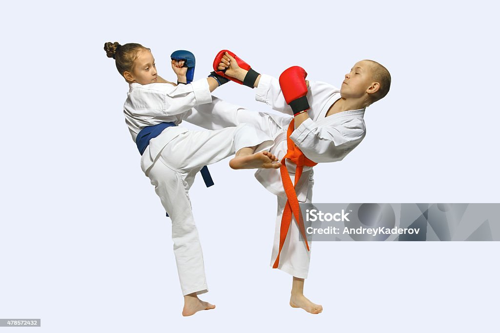 Sportsmen with overlays on hands are training hitting  mawashi geri 2015 Stock Photo