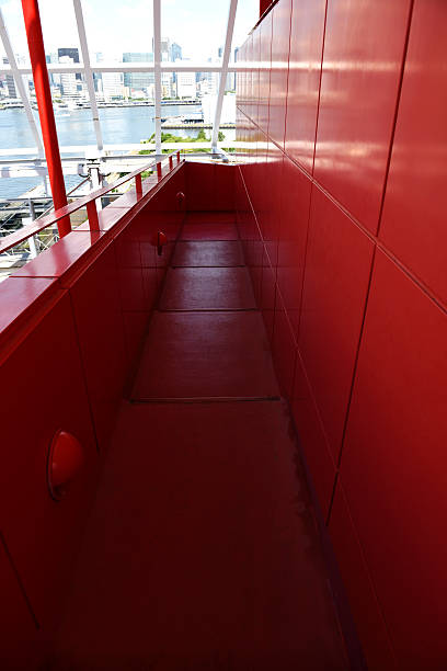 istock Red passage against skyscraper and Tokyo Bay 478572928