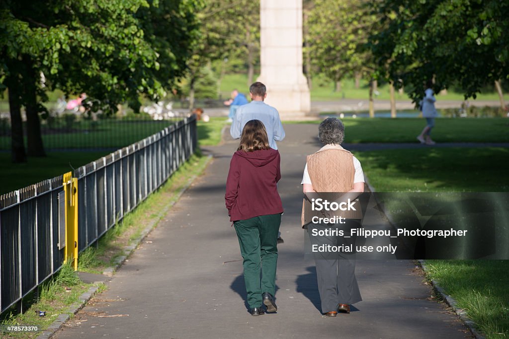 Enjoying the day Glasgow,Scotland UK - June 9, 2015: people are walking in the city park on a sunny day in Scotland UK enjoying the day  2015 Stock Photo