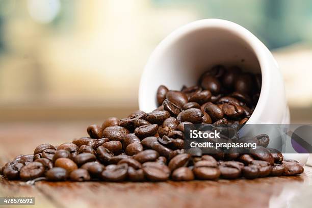 Coffee Beans Cup On Wooden Table By Window Stock Photo - Download Image Now - 2015, Aromatherapy, Backgrounds
