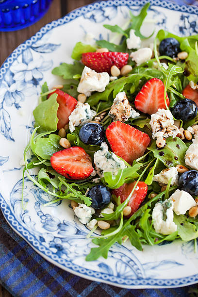 istock Arugula, strawberry, blueberry and blue cheese salad 478578294